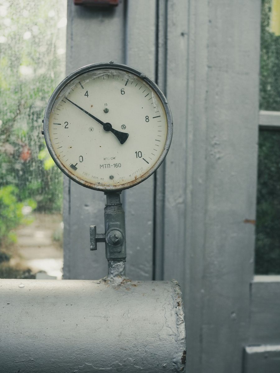 Water pressure gauge on a pipe used to check well pressure tank settings