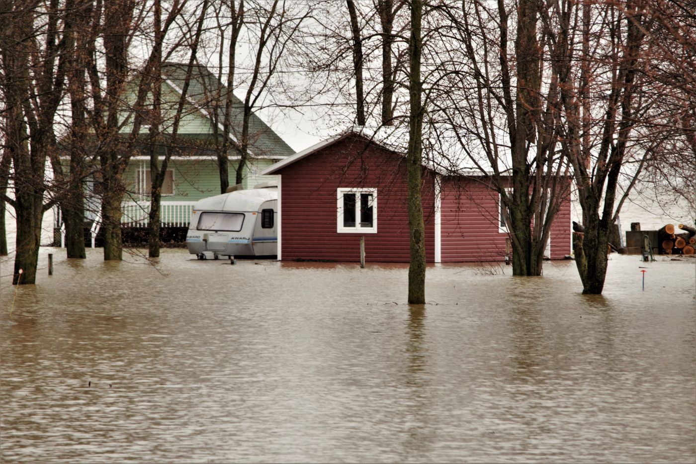 House surrounded by floodwater after heavy rain