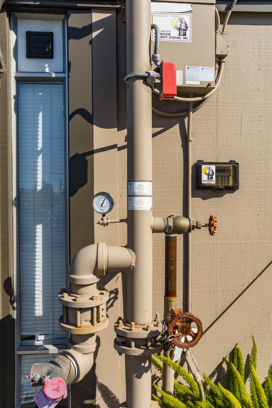 Water pipes, valves and a gauge used during a well flow and pressure test