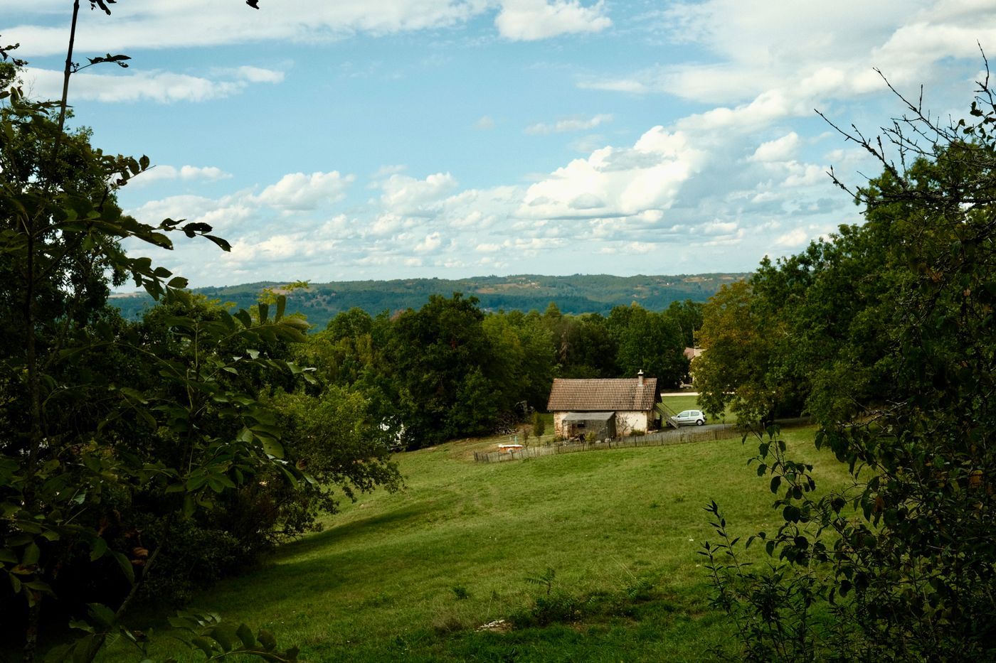 Rural home on a green hillside served by a private well
