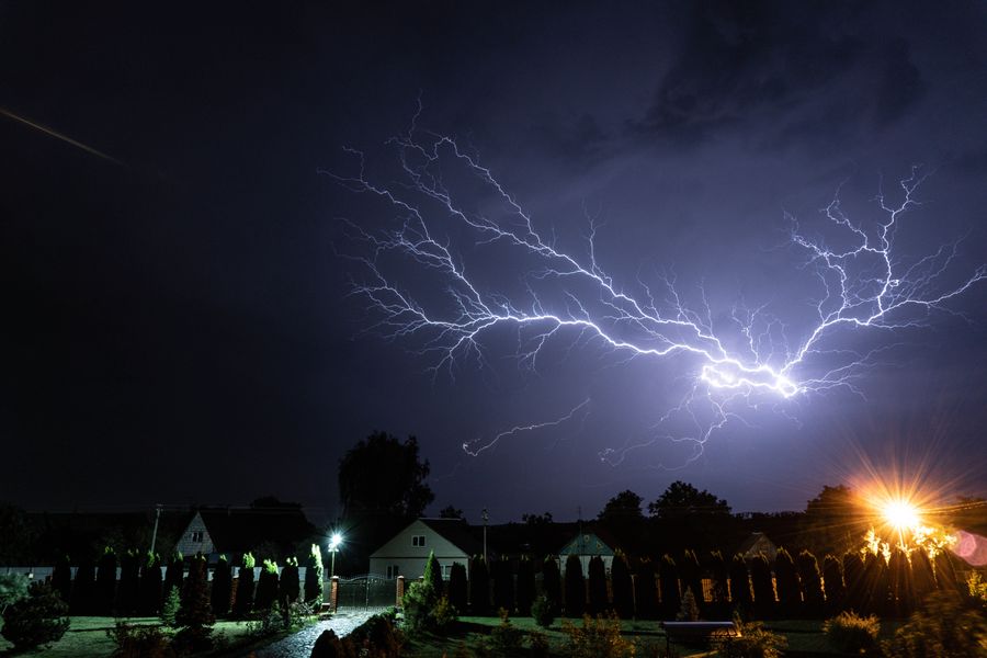 Night thunderstorm over homes, when sump pumps work hardest