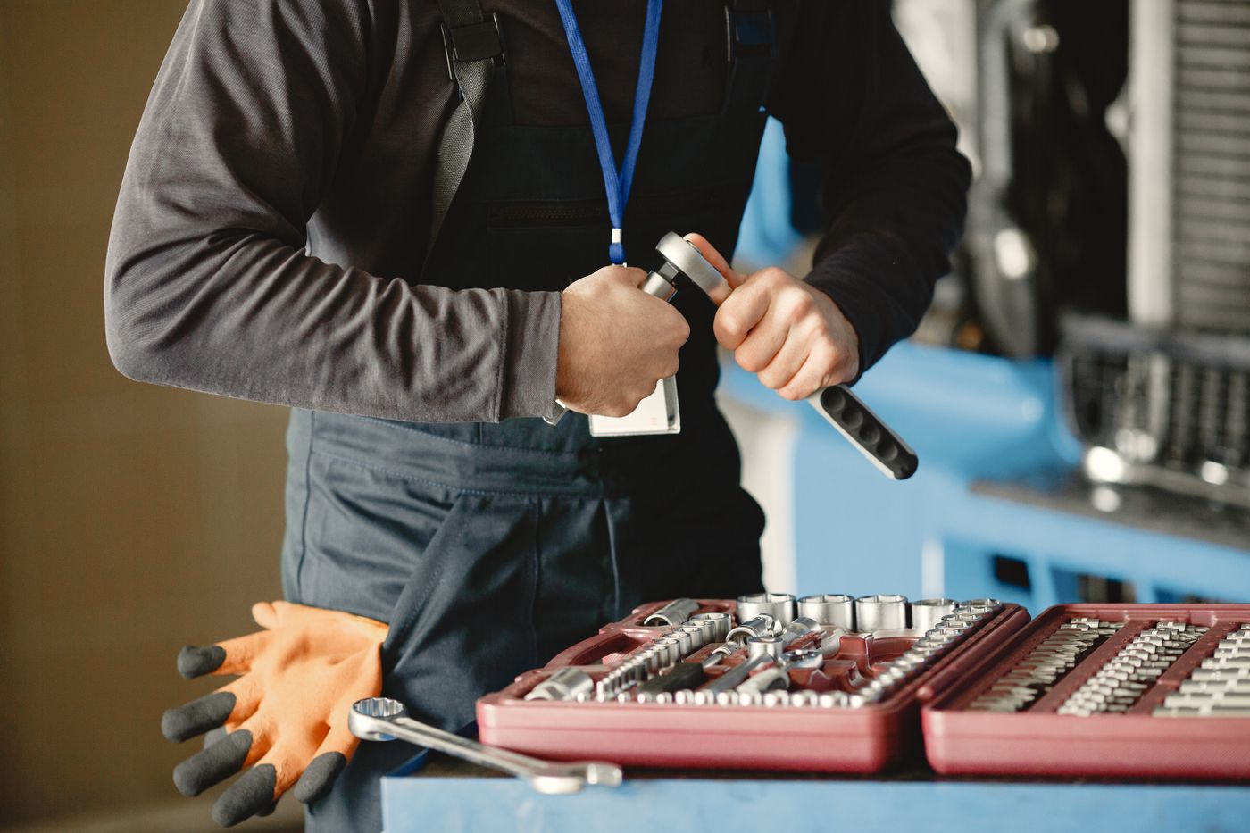 Well service technician with a wrench and toolbox ready for a pump repair