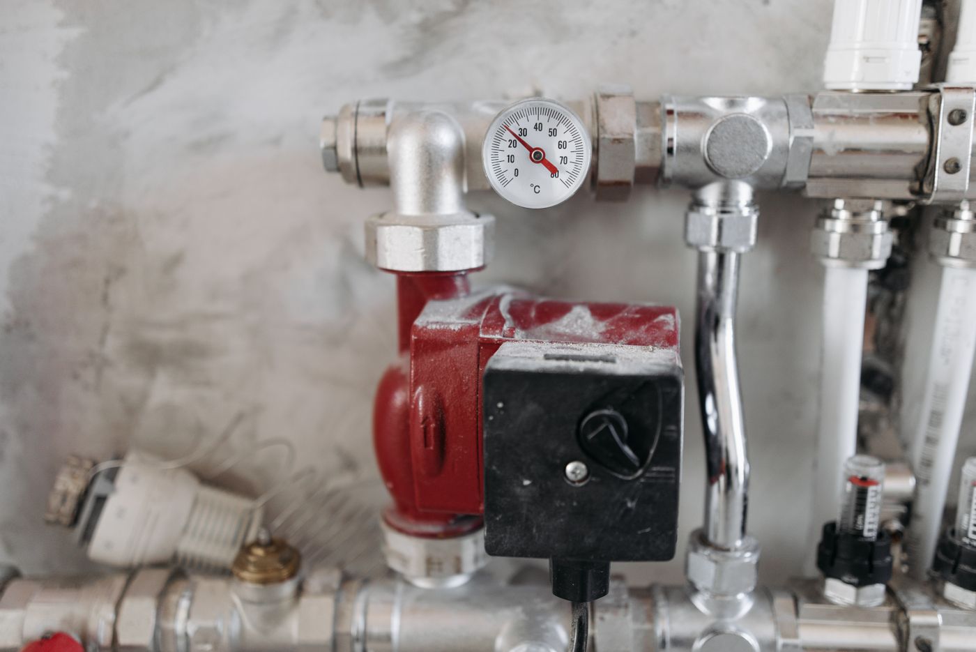 Pressure gauge and pump on a water manifold during system pressure testing