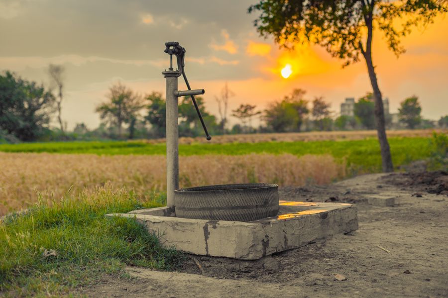 Old shallow well with a pump on a rural property